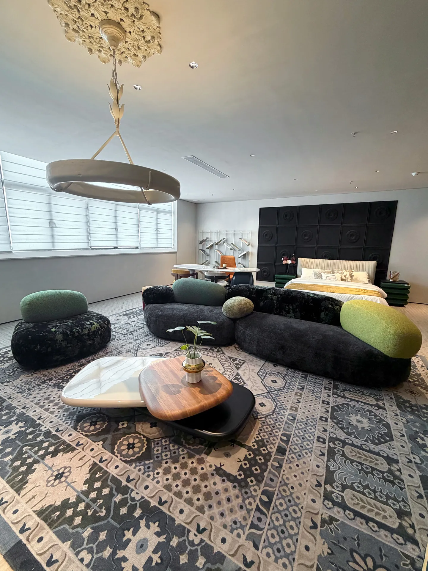 Wall decoration: Sofa pebble organic modular 007 styled in a live room set at EvergoCasa's Foshan showroom